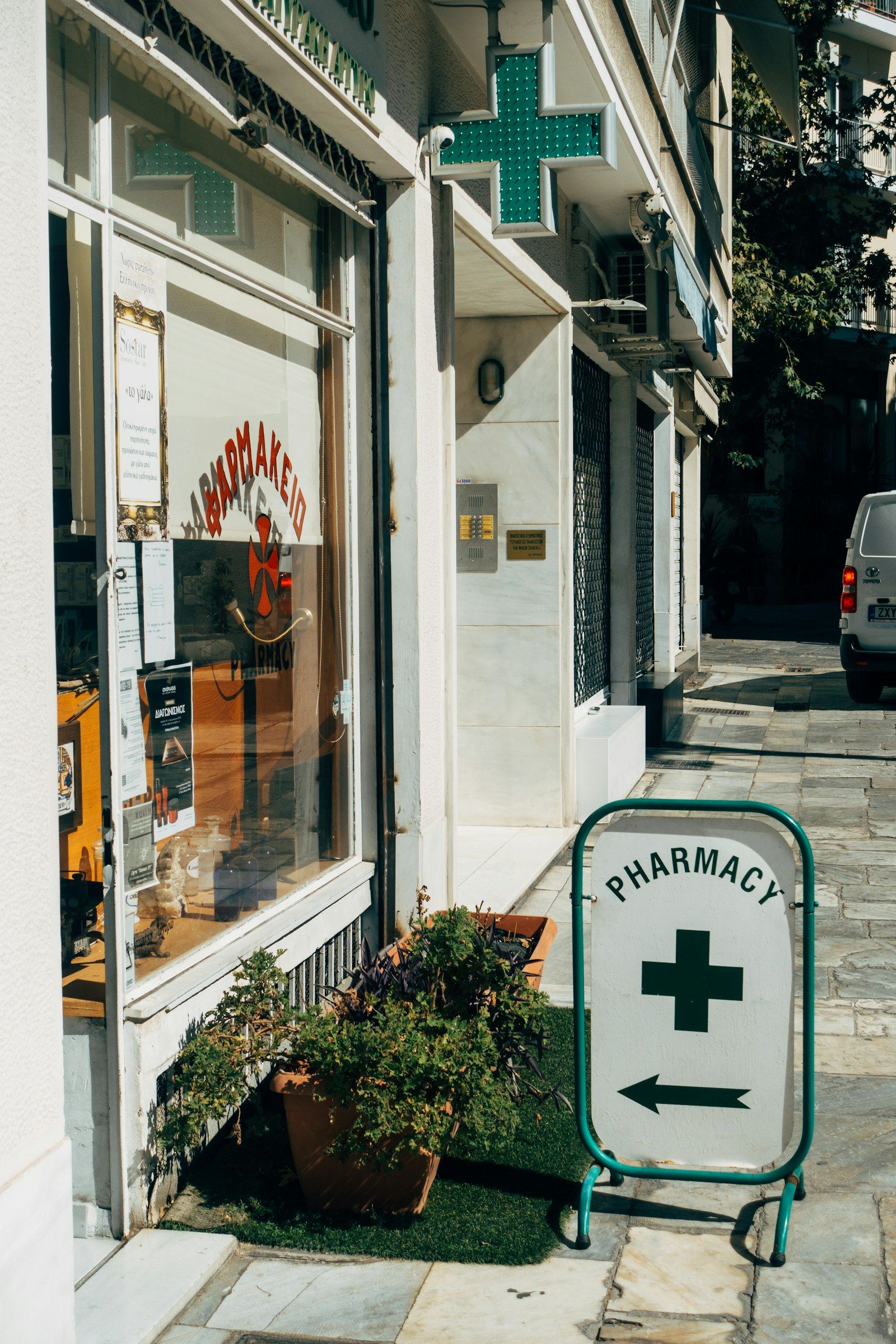 Street entrance with the pharmacy sign